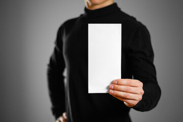 Man showing blank white flyer brochure booklet. Leaflet presentation. Pamphlet hold hands. Man show...