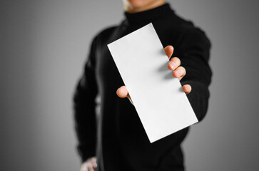 Man showing blank white flyer brochure booklet. Leaflet presentation. Pamphlet hold hands. Man show...