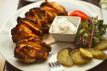 Syrian grilled chicken wings with coriander, garlic and lemon (jawaneh)