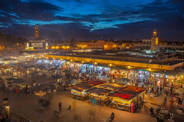Place Djemaa el-Fna in Marrakech, Morocco, at twilight. The most famous tourist hotspot in...