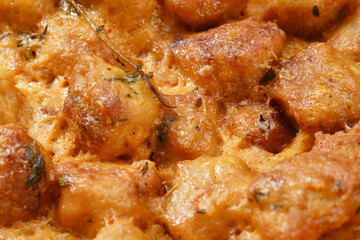 Fried meatballs with spices in cream sauce.  Shallow depth of field. Close up