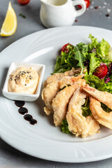 Shrimp fried in batter and sauce with salad. Healthy food, keto diet, diet lunch concept, vertical image. top view. place for text