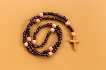 Faith and prayer concept - rosary beads with cross