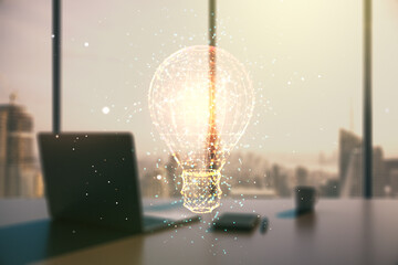 Double exposure of creative light bulb hologram and modern desktop with laptop on background, research and development concept