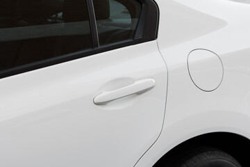 White modern car details - fuel tank cap ( closed petrol cover ) and door handle