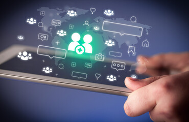 Close-up of a hand using tablet, social media concept