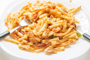 Boiled macaroni cooked with tuna fish.