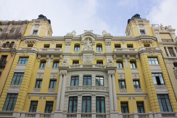 Fototapeta na wymiar Beautiful historical building at Gran Via of Madrid, Spain