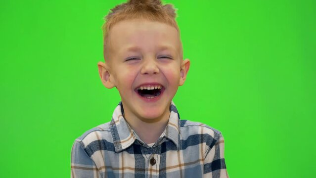 5 year old boy laughing and playing around, chromakey
