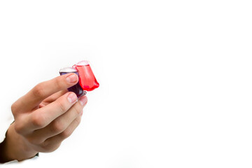 The hand holds a gel liquid powder on a white background.