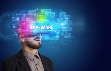 Businessman looking through Virtual Reality glasses
