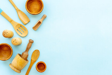 Flat lay of wooden kitchen utensils and cookware