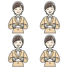 笑顔で名刺を差し出すスーツの中年女性（カラー）