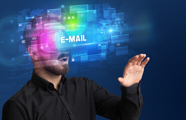 Businessman looking through Virtual Reality glasses