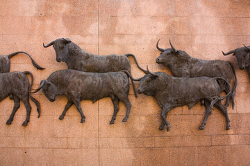 Bas relief with bulls near Plaza de Toros de Las Ventas in Madrid, Spain