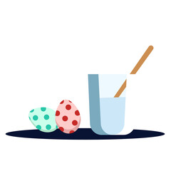 water and a brush for decorating Easter eggs