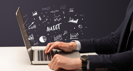 Businessman working on laptop, business concept