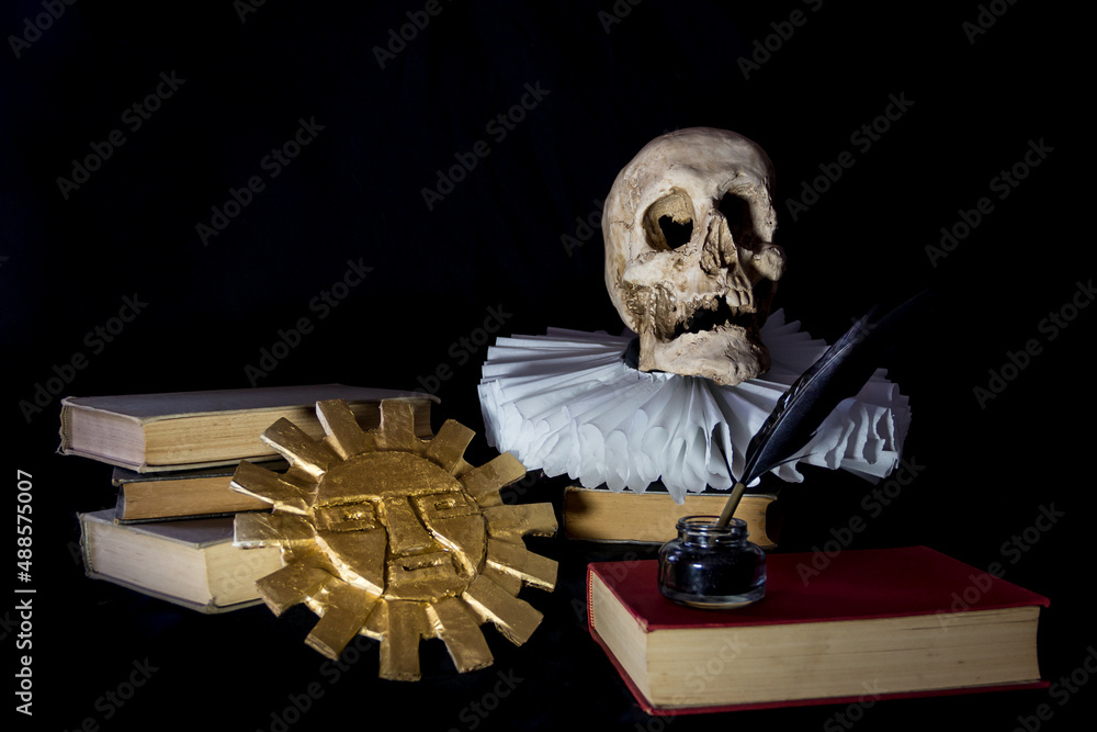 Poster On a black background books with a human skull, a ruff and the Inca sun, symbols of universal literature. Day of the book