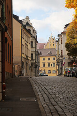 Fototapeta premium Old paved street in the center of Augsburg, Germany