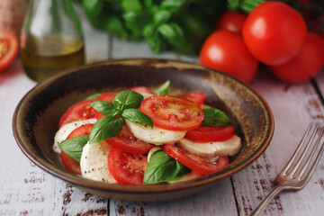 A bowl with traditional Italian caprese salad	