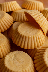 Tartlets made of dough. Vertical photo.