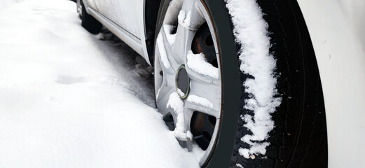 snow covered car tire