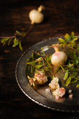 pomegranate fruits on a metal plate