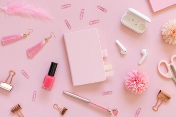 Obraz na płótnie Canvas Hardcover notebook and Pink school girly accessories on pastel pink Top view, mockup