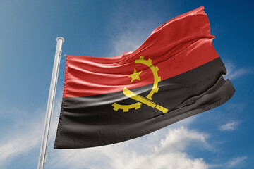 Angola Flag is Waving Against Blue Sky - obrazy, fototapety, plakaty