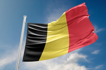 Belgium Flag is Waving Against Blue Sky