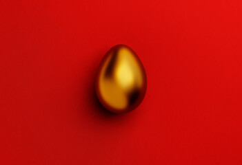 Golden easter egg on red background from above. Minimal flat lay greeting card with luxury easter egg festive concept.
