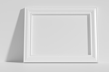 Fototapeta premium Horizontal rectangular photo frame on floor leaning at wall