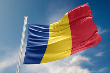 Romania Flag is Waving Against Blue Sky