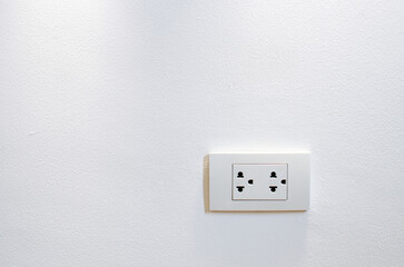 Thailand power socket on the white wall background
