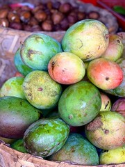 mango and papaya fruit on the market