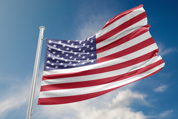 USA Flag is Waving Against Blue Sky