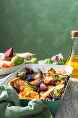 Mixed root vegetable roast with herbs. Healthy simple grill food