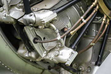 Close-up at WWII fighter plane engine and system part. Industrial and transportation equipment object photo. Selective focus.