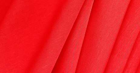 Red silk satin background. Luxurious background design. Copy space for text. Valentine, Christmas.