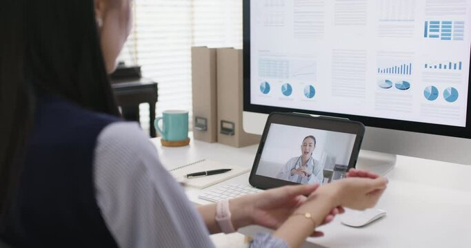 Asia people young woman worker work at home job video call telemedicine online clinic teleconsult app for workforce care meet chat or consult to doctor remote advice teach to relax stiff neck pain.