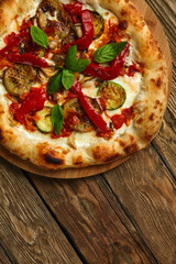 pizza vegetables tomato, onion, pickles, mushrooms, etc. vegan or vegetarian food ready to eat no meat portion on the table for healthy meal snack outdoor top view copy space food background rustic