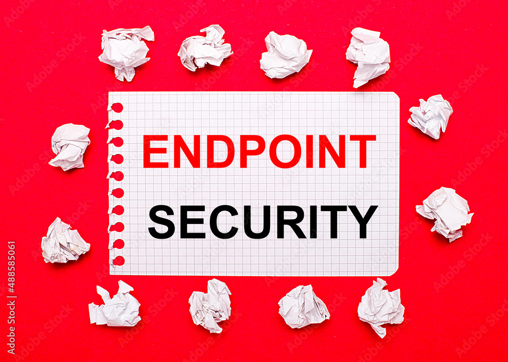 Poster on a bright red background, white crumpled sheets of paper and a sheet of paper with the text endpoi