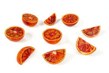 Blood oranges isolated on white background. Sliced fruit studio shots.