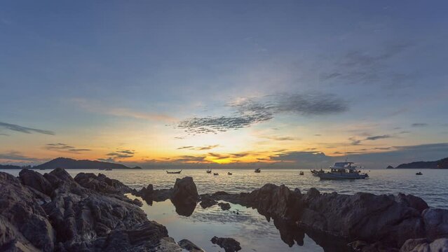 
time lapse reflection of sunset in water trapped in rocks.
beautiful sunset at Kalim beach fishing boats in the sea.
Kalim beach is conected to Patong beach there have a lot of reef and rocks
