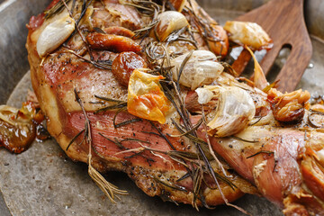 Roasted lamb shoulder with garlic, rosemary and thyme. Lamb meat, shoulder of mutton with spices. Lamb leg fillet ready to eat. Selective focus