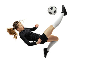 Jumping. One sportive girl, female soccer player training with football ball isolated on white...