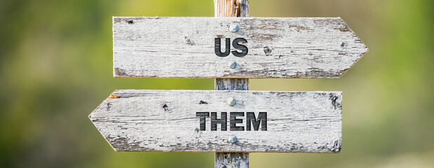 opposite signs on wooden signpost with the text quote us them engraved. Web banner format.