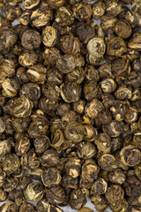 Jasmine Pearls Green Tea on a white background. medicinal asian herbal tea. Close up