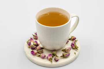 Bud Rose Tea isolated on a white background. Medicinal herbal tea.