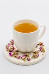 Obraz na płótnie Canvas Bud Rose Tea isolated on a white background. Medicinal herbal tea.